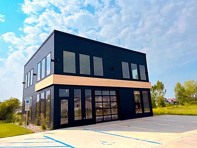 Navy commercial building with a wood-look band